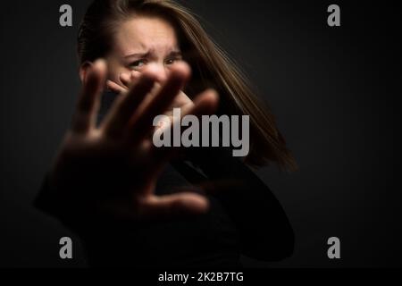 Young woman suffering from a severe depression/anxiety Stock Photo