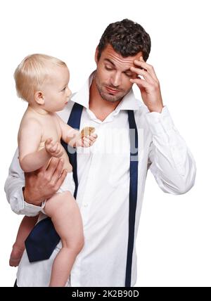 Daddys really tired this evening. An exhausted father holding his son after a long day at work. Stock Photo