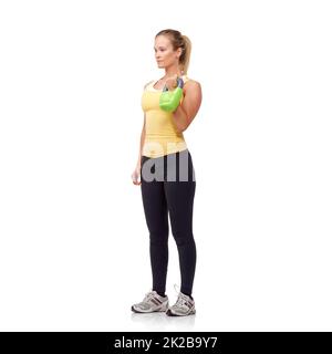 Get your workout on. Studio shot of an attractive woman working out with weights. Stock Photo