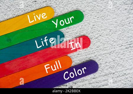 live your life in full color text on color sticks. Motivational concept. Stock Photo