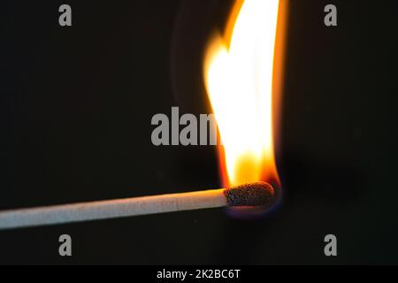 match is burning hot on black Stock Photo
