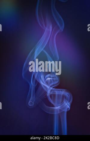 Smoky clouds on blue and black background Stock Photo