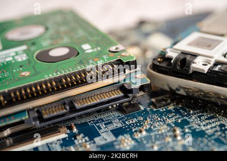 Technician repairing inside of mobile phone by soldering iron. Integrated Circuit. the concept of data, hardware, technology. Stock Photo