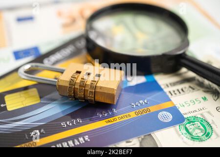 Credit card with password key lock on US dollar background. Stock Photo