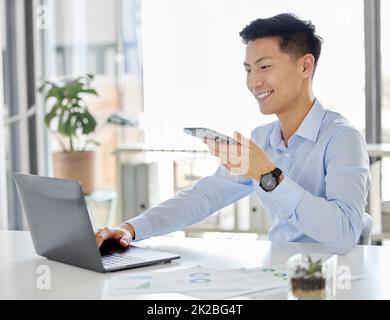 Asian digital marketing, planning and businessman with phone working on laptop with team brainstorming idea in office. Creative worker with website Stock Photo