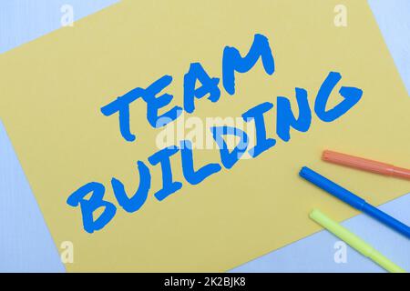 Text caption presenting Team Building. Word for Types of activities used to enhance social relations Flashy School Office Supplies, Teaching Learning Collections, Writing Tools Stock Photo