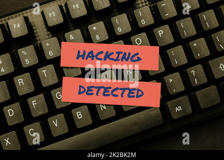 Writing displaying text Hacking Detected. Concept meaning activities that seek to compromise affairs are exposed Typing Program Schedule, Retyping And Debugging Program String Codes Stock Photo