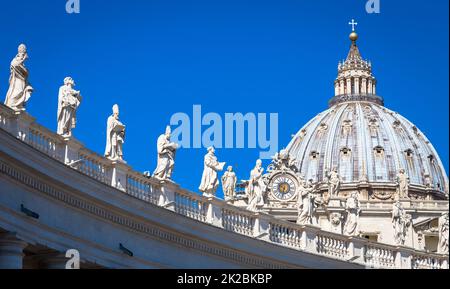 Decoration of statues on Saint Peter Cathedral with the Cupola in background - Rome, Italy Stock Photo