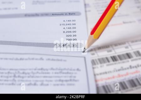 Utility energy bill with pencil blurred background Stock Photo