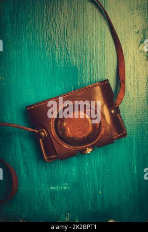 Top view of an old photograph scrapbook album with a tied string