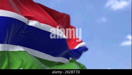 Detail of the national flag of Gambia waving in the wind on a clear day ...