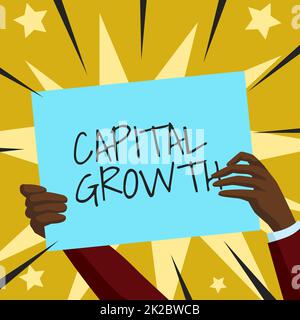 Inspiration showing sign Capital Growth. Word for increase in the value of an asset or investment over time Hands Holding Paper Showing New Ideas Surrounded With Stars. Stock Photo