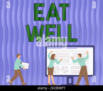 Hand writing sign Eat Well. Business idea Practice of eating only foods that are whole and not processed Colleagues Drawing Standing Beside Table Projection Graph Chart Stock Photo