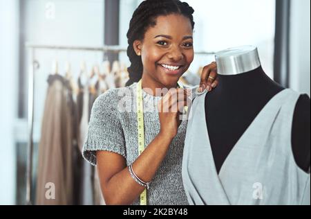 Itll be the perfect fit. Cropped portrait of a young fashion designer working on a mannequin in her workshop. Stock Photo