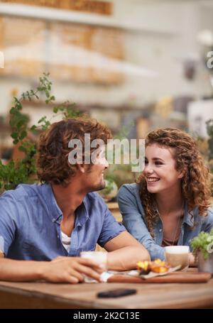 We cant continue this level of coolness on an empty stomach. Young people enjoying a beverage at a sidewalk cafe. Stock Photo