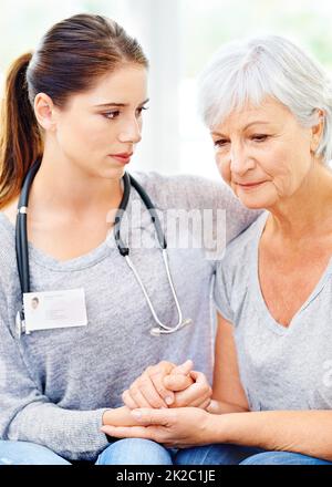 Dealing with the worst prognosis. A doctor comforting a senior patient after some bad news. Stock Photo