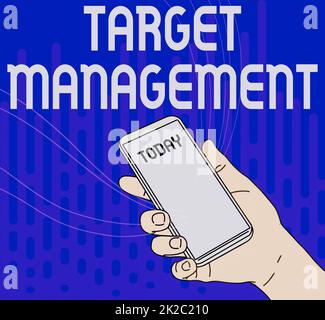 Conceptual display Target Management. Business idea nurturing the engagement of customers in the business Hand Holding Mobile Device With Blank Screen Showing New Technology. Stock Photo