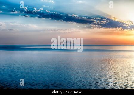 Scenic sunset with view over Stromboli Volcano from Tropea, Italy Stock Photo