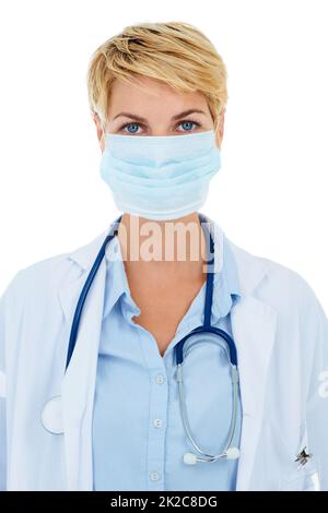 Protective gear to prevent infections. A young female doctor with her mask on. Stock Photo