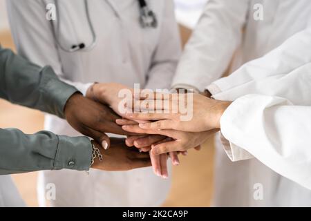Medical Team Stacking Hands Against Stock Photo