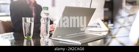 Water Bottle And Drinking Glass On Desk Stock Photo
