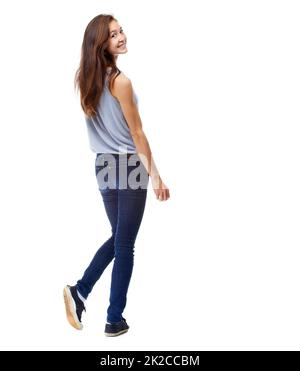 Taking a look back. Full-length studio shot of a beautiful young woman looking over her shoulder isolated on white. Stock Photo