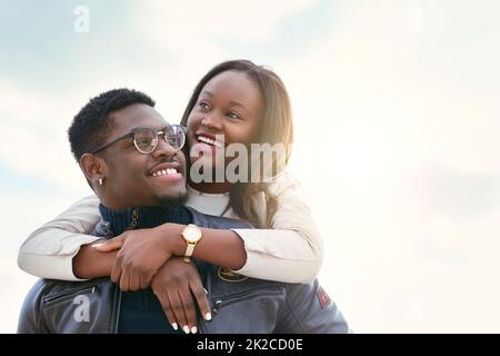 What a lovely day this turned out to be. Shot of an affectionate young couple bonding together outdoors. Stock Photo