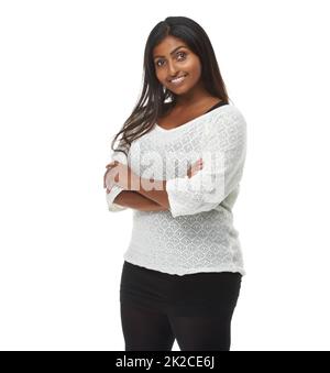 Cool, casual and confidence. Studio shot of an attractive woman against a white background. Stock Photo