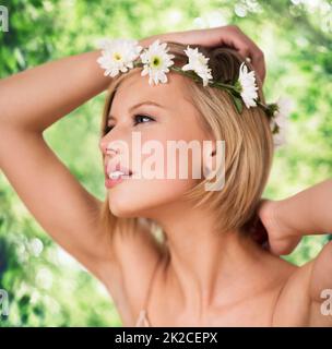 Natural beauty. A cropped shot of a beautiful young woman wearing a flower crown.