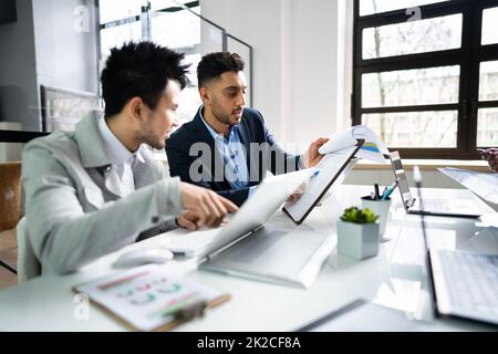 Financial Data Analysts Discussing Business Stock Photo