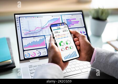 African Advisor Using KPI Dashboard Stock Photo