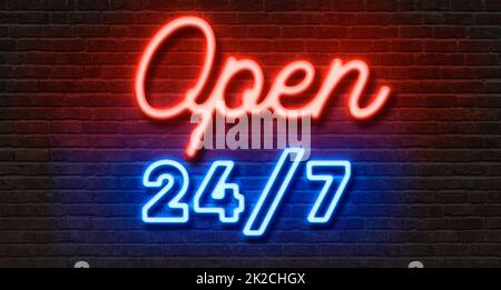 Neon sign on a brick wall - Open 24 7 Stock Photo
