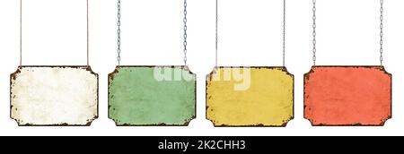 Four empty vintage tin signs hanging on a white background Stock Photo