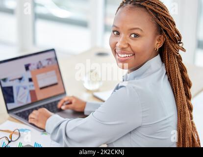 Black woman manager on laptop planning and working with company business email, SEO chart and graph for success. Corporate management employee with Stock Photo