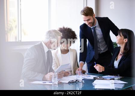 Business discussions. Cropped shot of a group of business colleagues meeting in the boardroom. Stock Photo