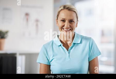 Im here to help you heal. Cropped portrait of a mature female physiotherapist working in her office. Stock Photo