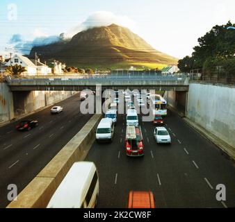 Home time in the city. Shot of a traffic on the motorway. Stock Photo