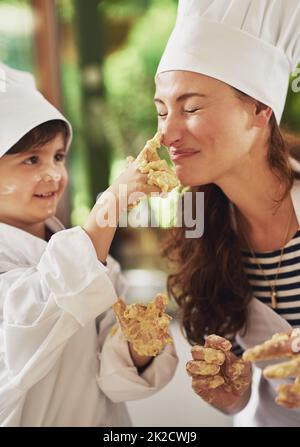 I think you have something right here. Shot of a mother and her young son with dough on their hands baking together in the kitchen. Stock Photo