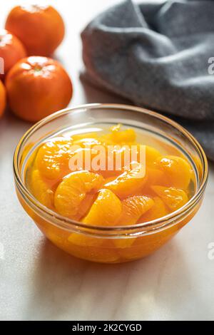 Canned tangerine. Pickled mandarin fruit in bowl. Stock Photo