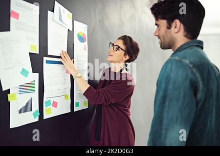 She always presents unfailing plans. Cropped shot of coworkers brainstorming in a modern office. Stock Photo