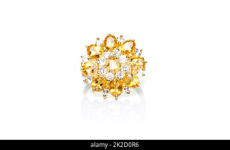 Yellow sapphire and Diamond Jewel or gems ring on white background with reflection. Collection of natural gemstones accessories. Studio shot Stock Photo