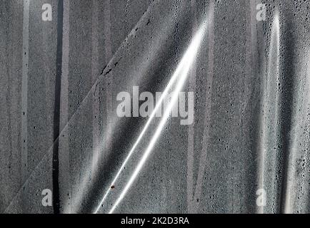 Background of the condensate drops on the film is polyethylene. Water drops texture Stock Photo