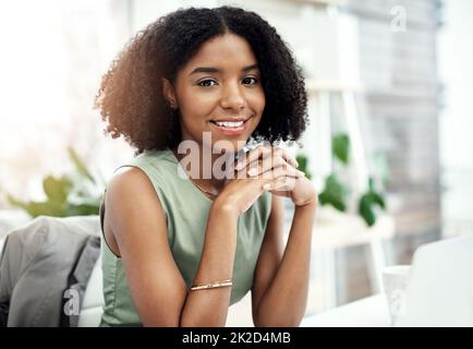 Im here for success. Cropped portrait of an attractive young businesswoman working at her desk in the office. Stock Photo