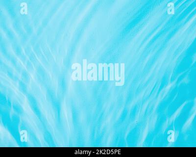 Ripple water texture with shadows on blue Stock Photo