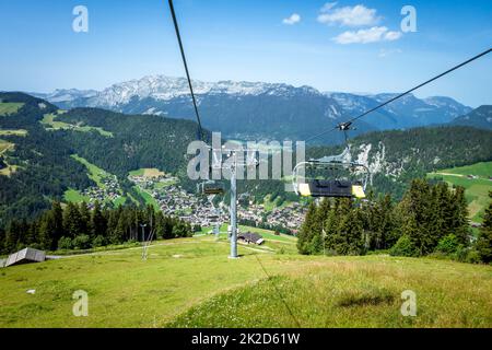 Chair lift above the village of La Clusaz, France Stock Photo