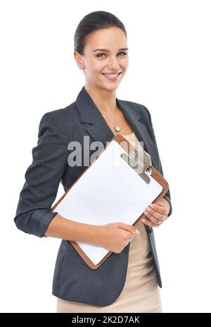 Rising star in the office. Studio portrait of a confident young female office worker isolated on white. Stock Photo