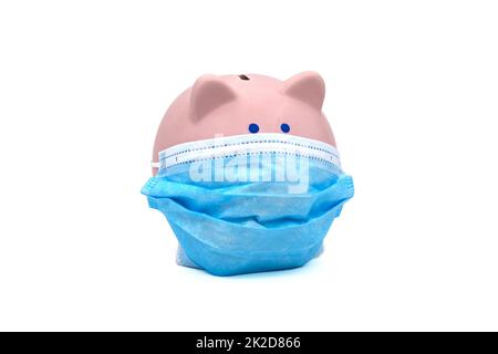 Piggy bank wearing surgical face mask Stock Photo