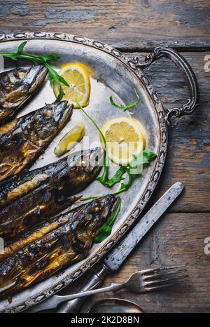 Mackerels on silver plate Stock Photo