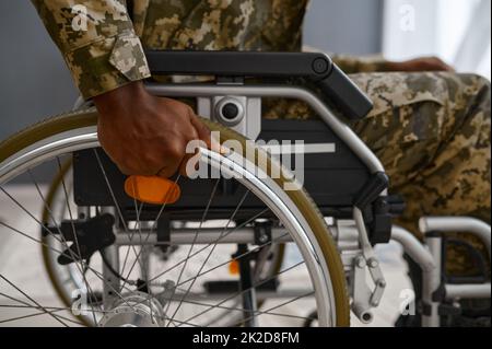 Unrecognizable military man with disability in wheelchair Stock Photo