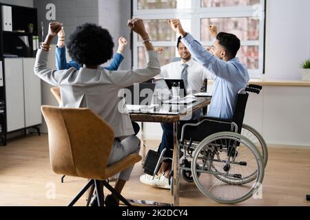 Diverse Excited Office Employee Celebrating Contract Stock Photo